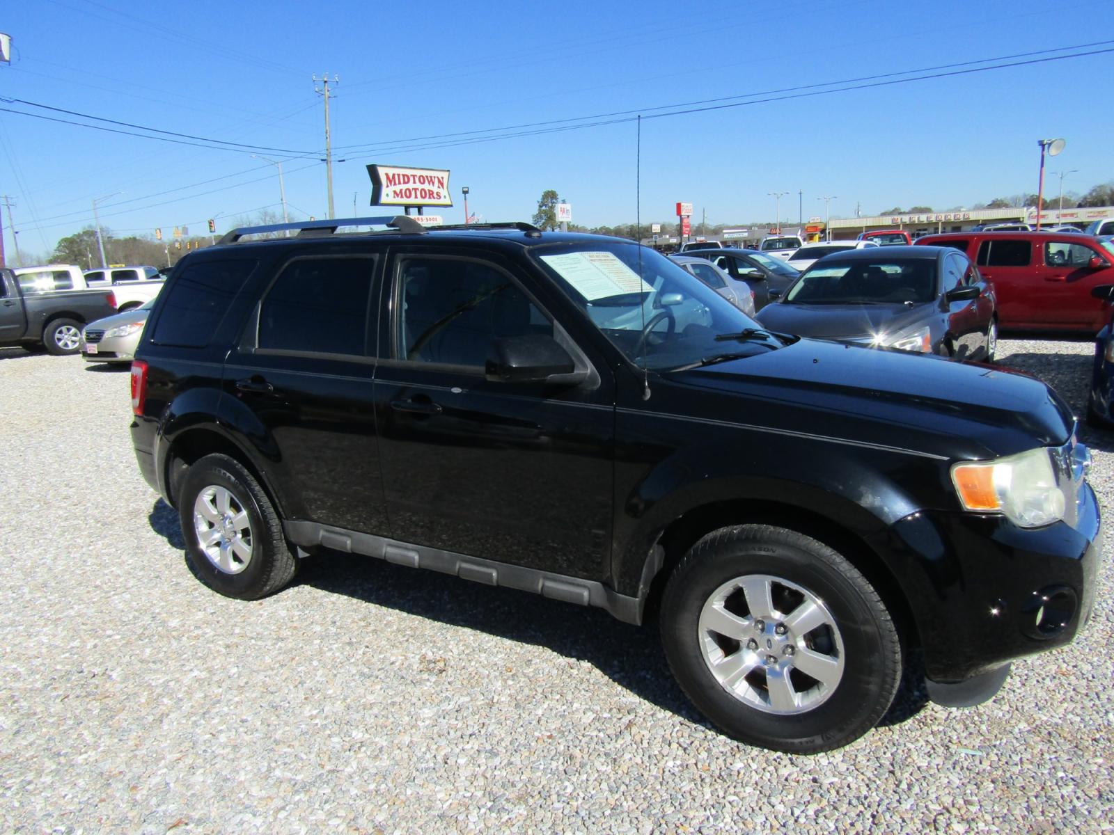 2010 Black Ford Escape Limited FWD (1FMCU0EG8AK) with an 3.0L V6 DOHC 24V engine, Automatic transmission, located at 15016 S Hwy 231, Midland City, AL, 36350, (334) 983-3001, 31.306210, -85.495277 - Photo #0